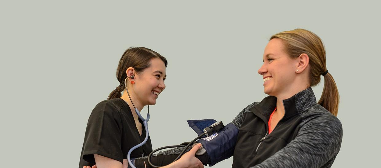 Woman riding exercise bike